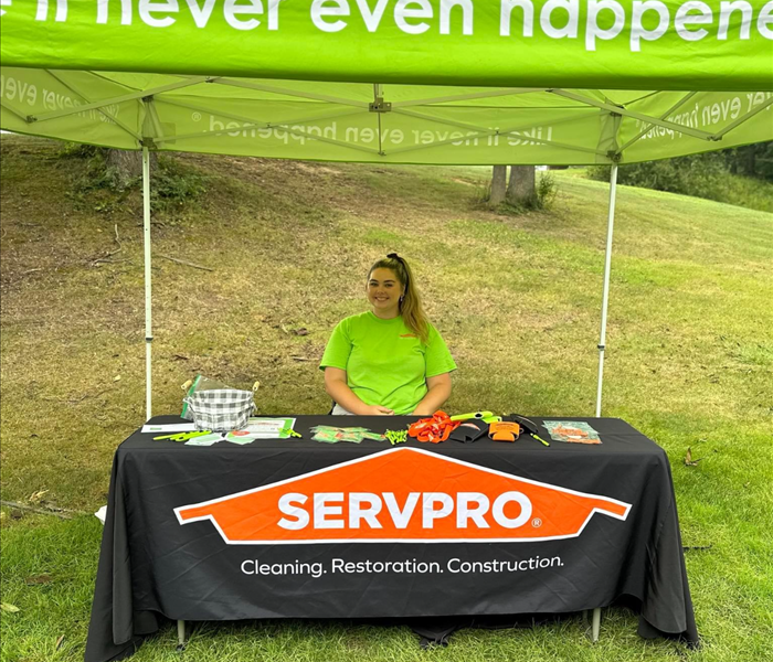 Sam under the tent on the golf course